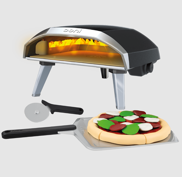 Miniature pizza oven toy with cooking tools and a toy pizza for children’s pretend play and learning