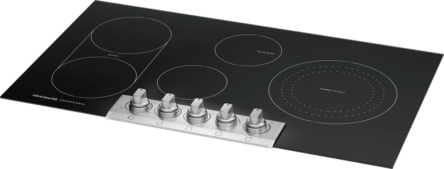 36-inch black radiant cooktop with five stainless steel control knobs and bridged heating element from appliances collection