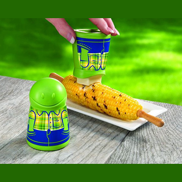 Talisman Designs Butter Boy Butterer spreading butter on grilled corn on the cob in outdoor kitchenware setting