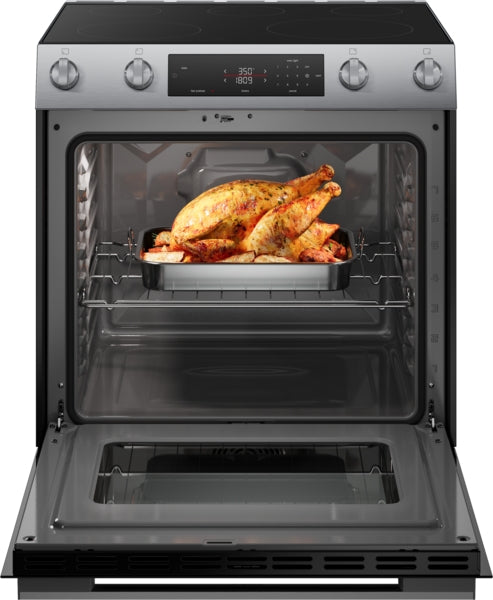 Open stainless steel electric freestanding range with roasted whole chicken on baking tray inside oven cavity