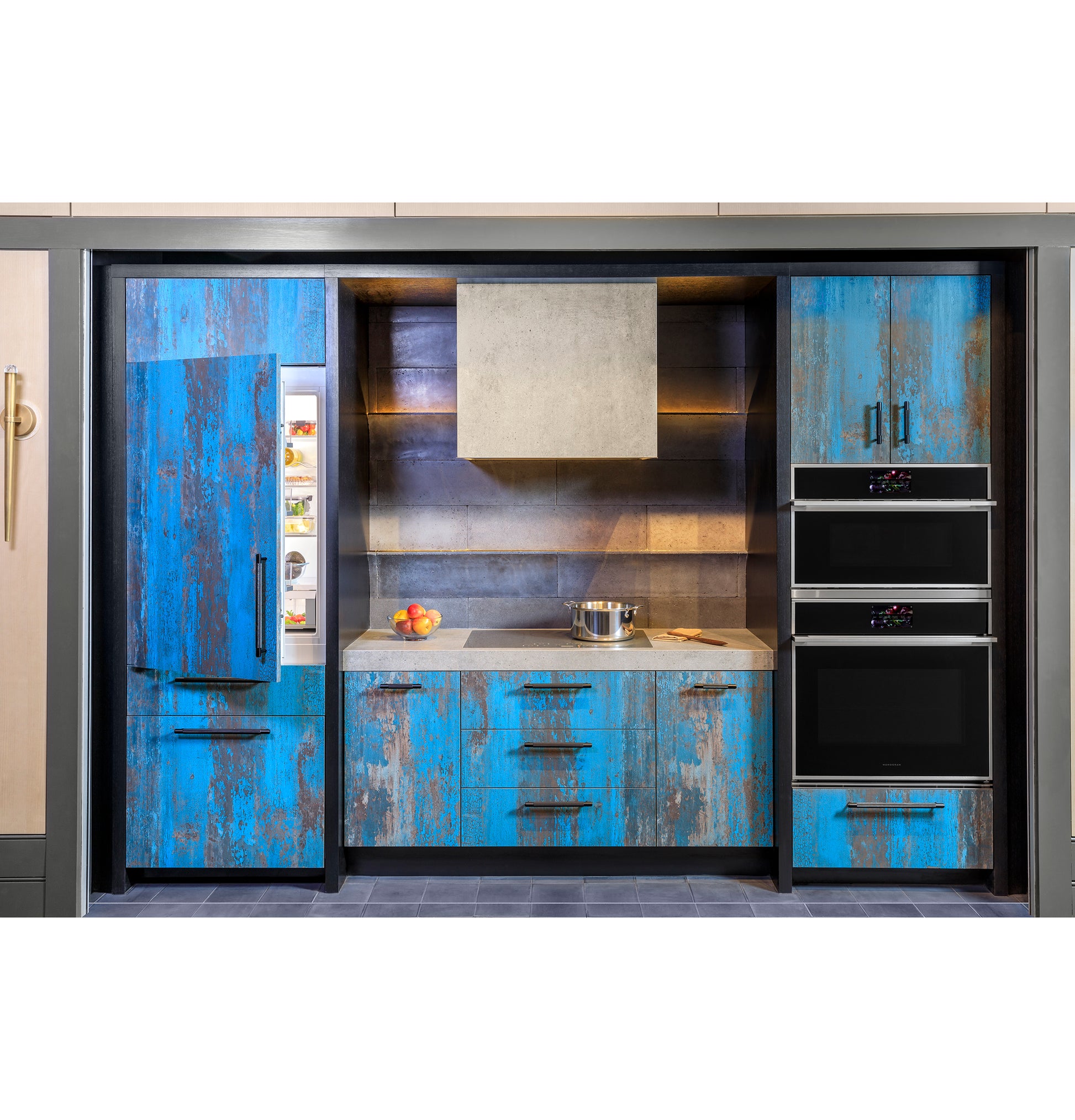 Rustic blue distressed cabinetry kitchen with built-in double wall ovens and refrigerator in appliances collection