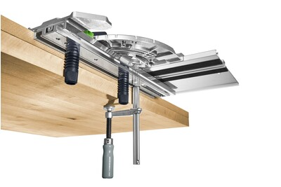 Festool guide rail accessory clamped to wooden workbench with metal fastening clamps and adjustment handles