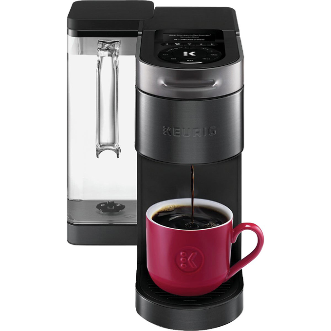 Black and stainless steel single-serve coffee maker brewing into a red ceramic cup with clear water reservoir for home use