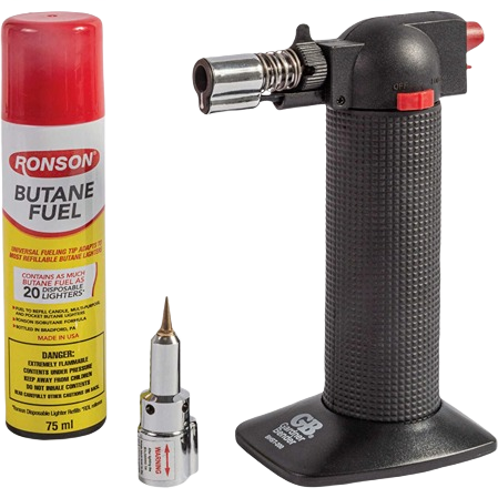 Black textured butane torch with metal tip, safety lock, and red adjustment button alongside fuel canister and nozzle attachment