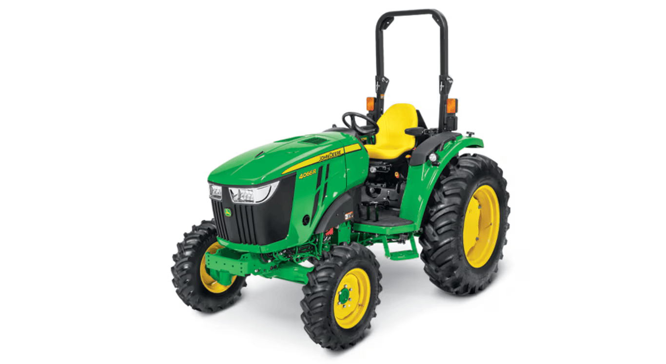 Green compact tractor with yellow seat and heavy-duty tires designed for outdoor and home improvement use