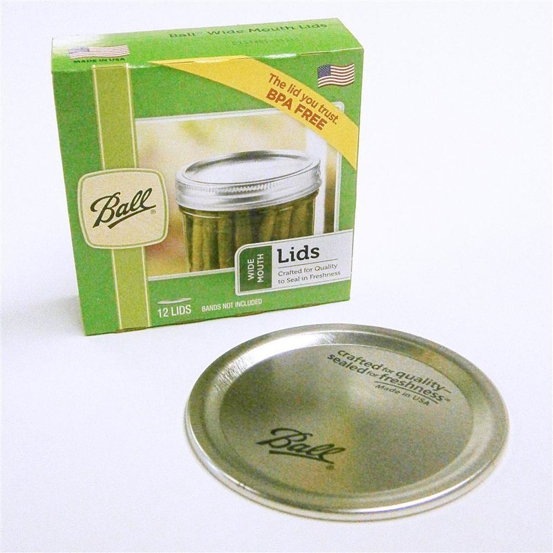 Green packaging of ball brand wide mouth dome canning lids 12-pack with a single metal lid in front kitchenware product