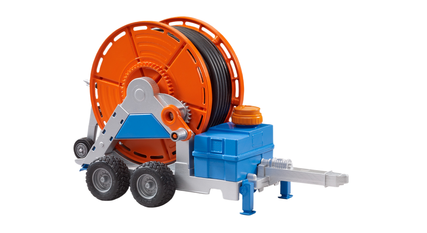 Agricultural irrigation toy trailer with orange hose reel and blue-gray frame, part of Bruder Toys collection under $100