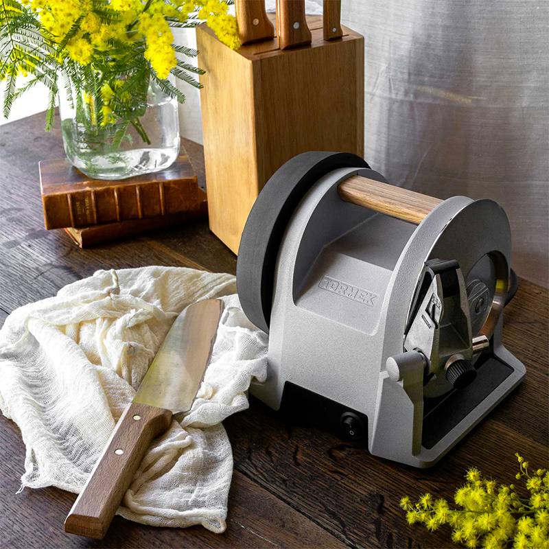 Gray kitchen knife sharpener with wooden handle details in woodworking tools and home improvement setting