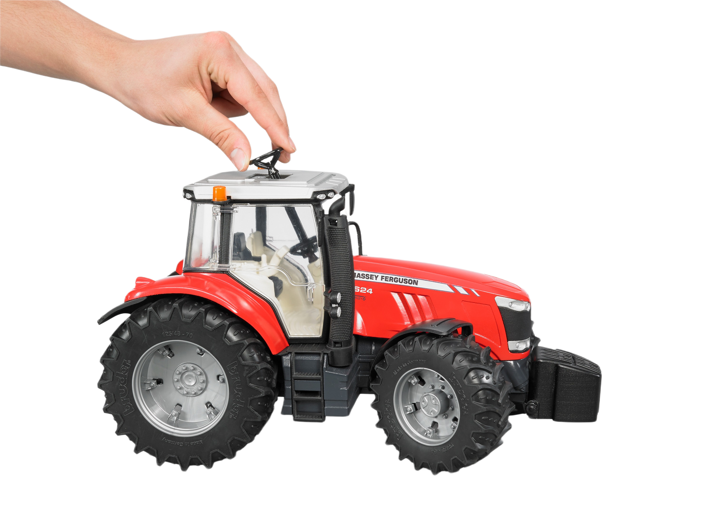 Hand adjusting red Bruder Toys Massey Ferguson 7624 tractor model in Vehicles & Remote Controlled Toys collection