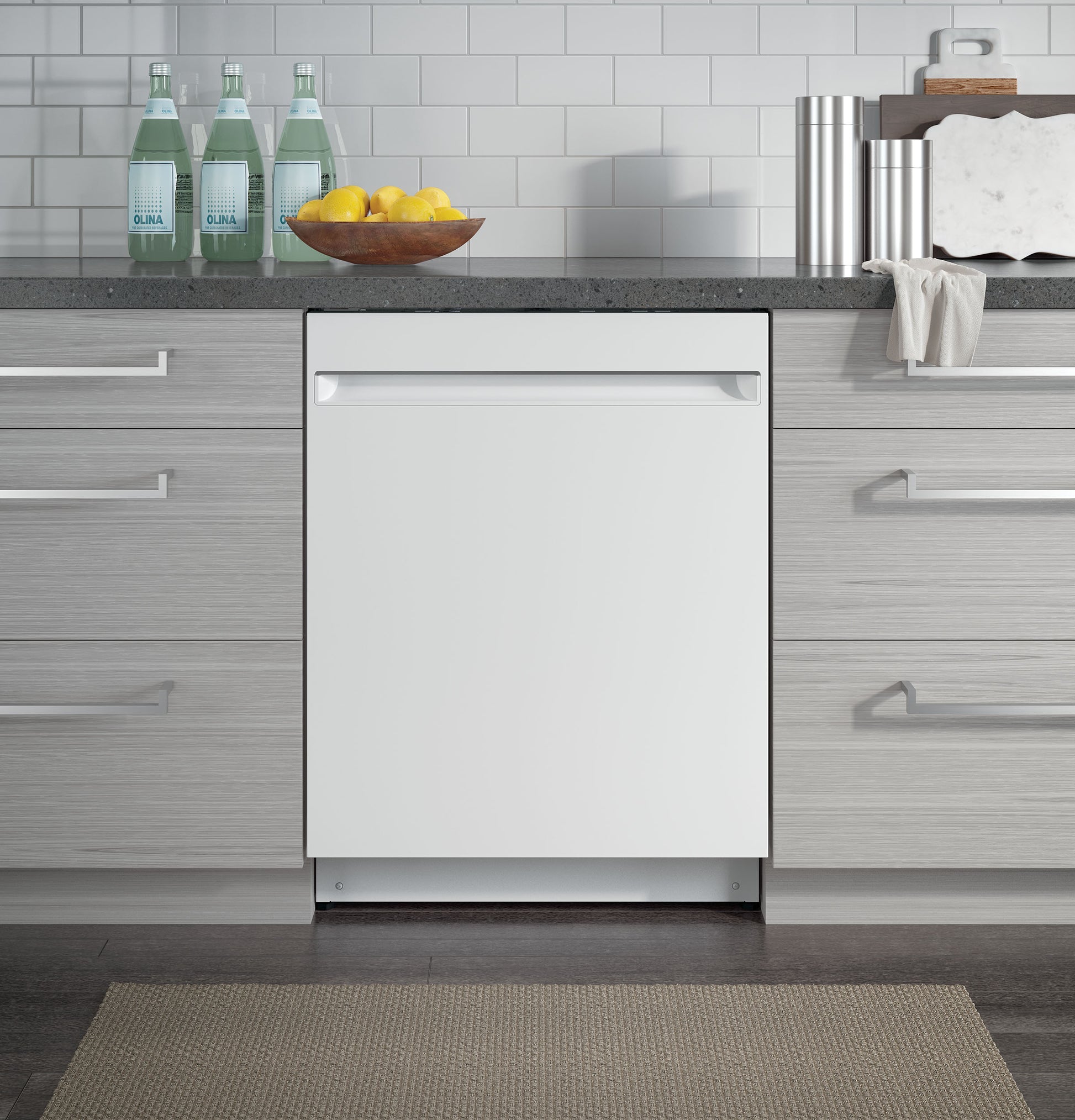 White built-in dishwasher integrated into modern kitchen cabinetry with gray wood finish and stone countertop