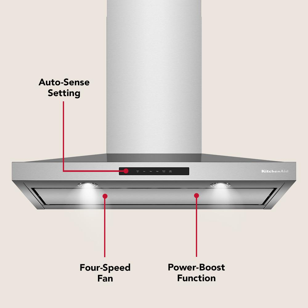 Stainless steel wall-mount range hood with digital controls, four-speed fan, and power-boost function in kitchen appliance collection