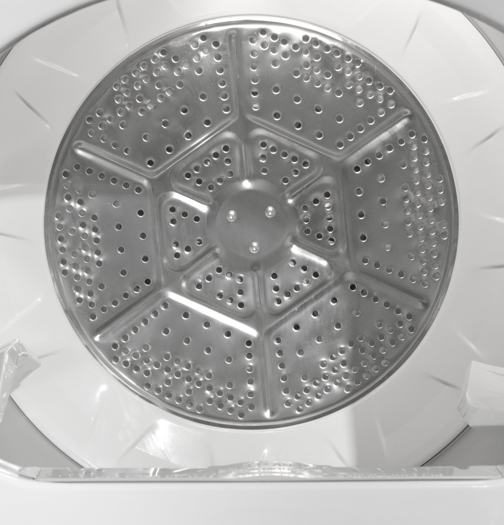 Interior view of metal dryer drum with perforated panel for airflow in Dryers and Appliances collection