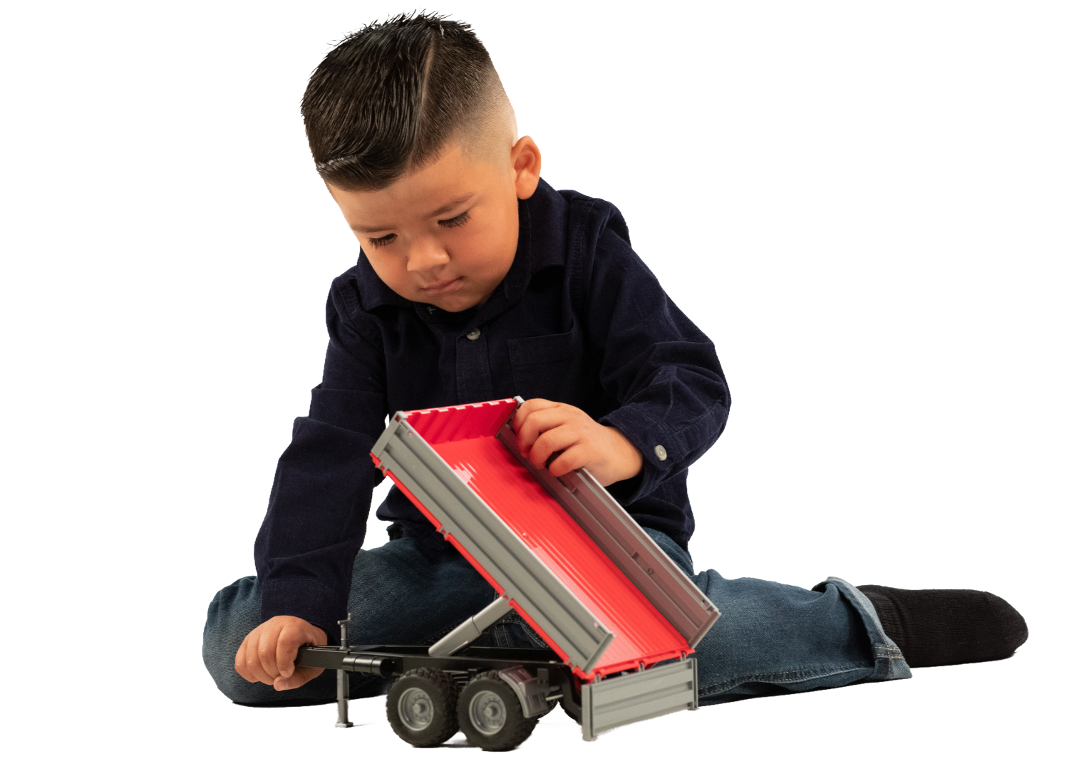 Child playing with small Bruder tipping trailer toy featuring grey sides and red interior in Vehicles & Remote Controlled Toys collection