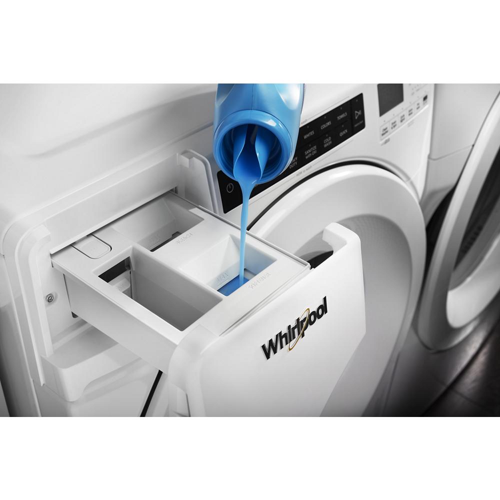 Liquid detergent being poured into the detergent dispenser of a white Whirlpool front load washer from Front Load Washers collection