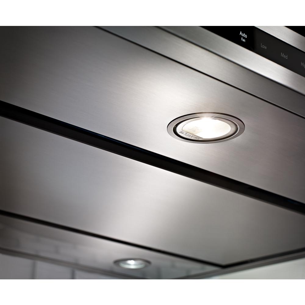 Close-up of stainless steel range hood with built-in LED lighting from KitchenAid appliances collection