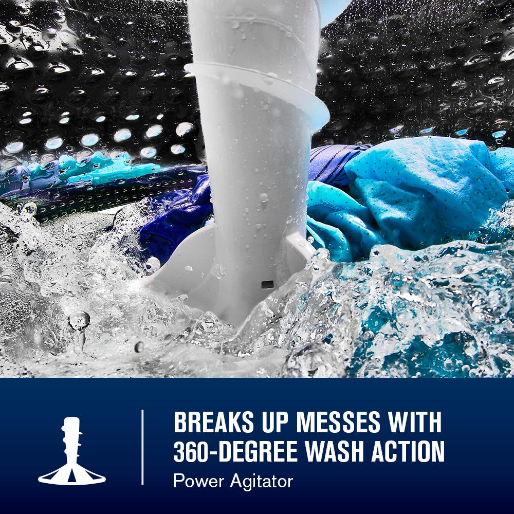 Close-up of white Power agitator in motion with water splashing and colorful clothes inside top load washer tub