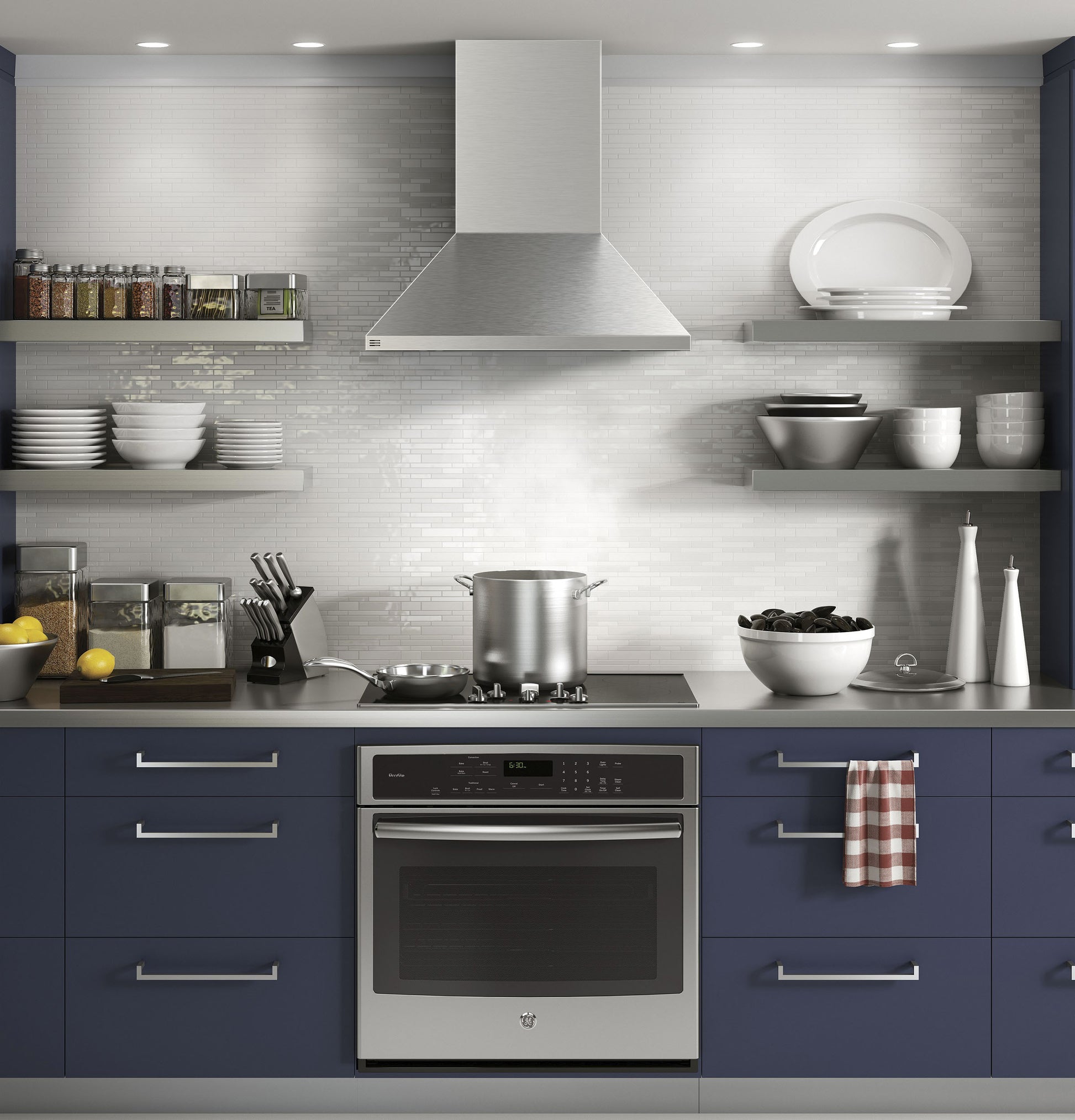 Modern kitchen setup with stainless steel pyramid vent hood, blue cabinets, and organized open shelving from range hoods collection
