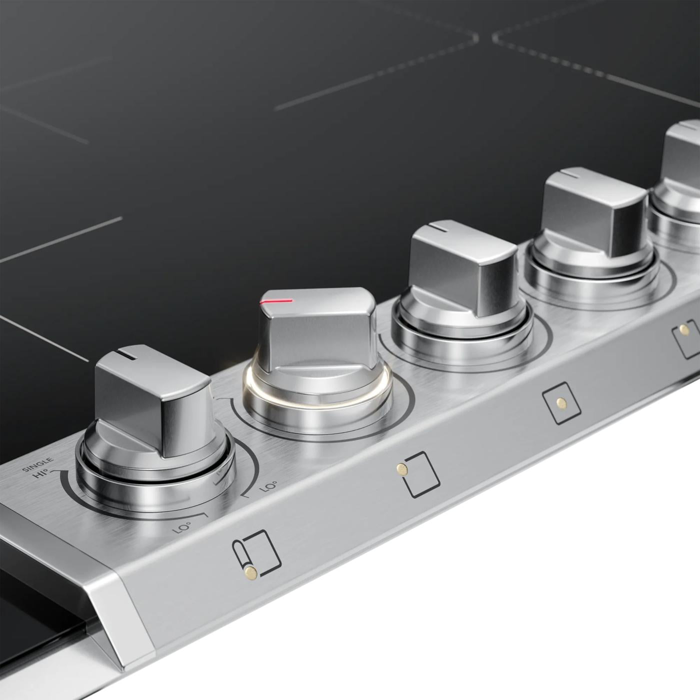 Close-up of stainless steel control knobs on a sleek black induction cooktop in kitchen appliances collection