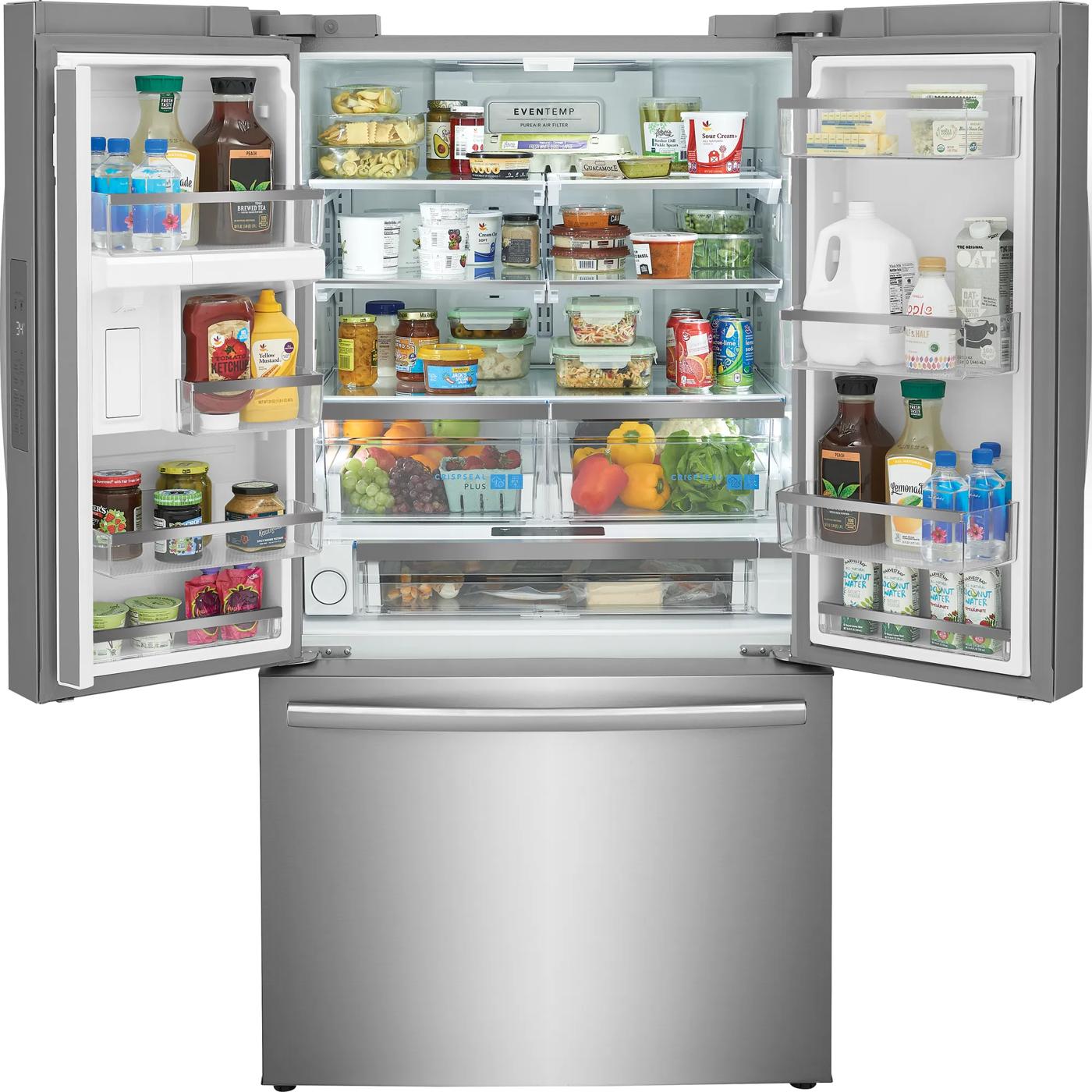 Open stainless steel French door refrigerator with organized shelves and bottom freezer drawer in kitchen appliance setting