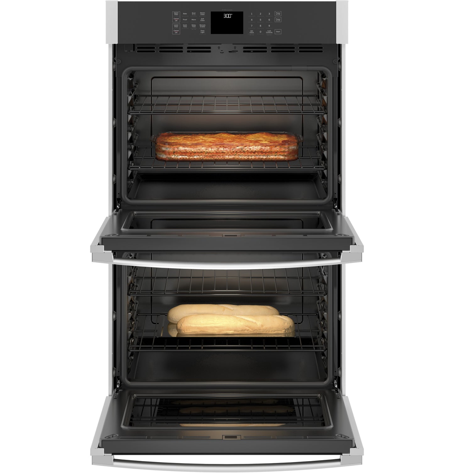 Open double wall oven with loaf of bread in upper oven and baguettes in lower oven in modern kitchen appliance setting