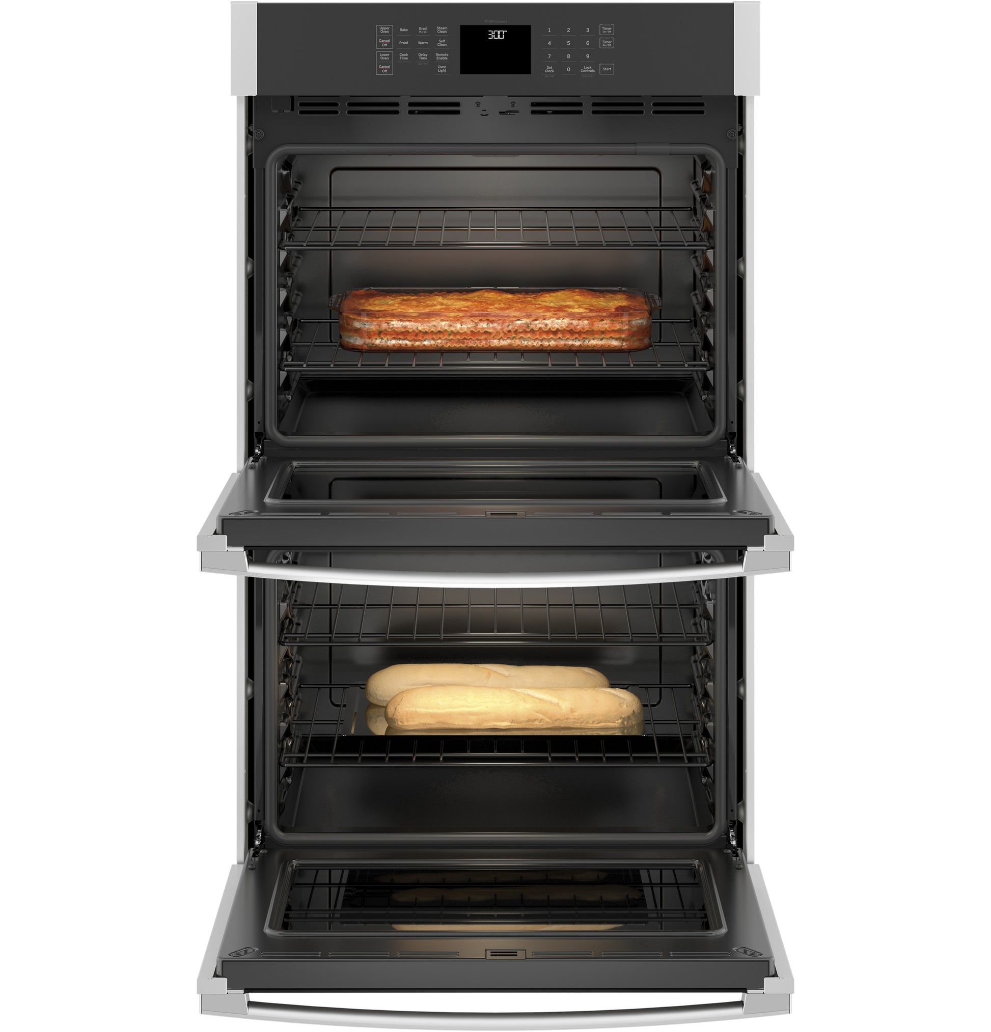 Open double wall oven with loaf of bread in upper oven and baguettes in lower oven in modern kitchen appliance setting
