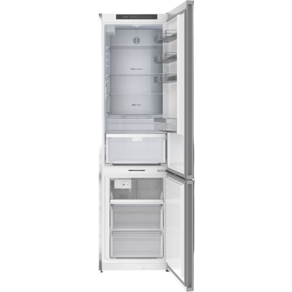 Interior view of a sleek free-standing fridge-freezer with separate compartments and clear shelving in kitchen appliances collection