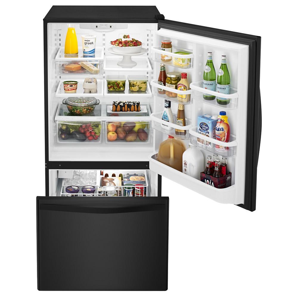 Open black bottom-freezer refrigerator with SpillGuard™ glass shelves and stocked interior from kitchen appliances collection