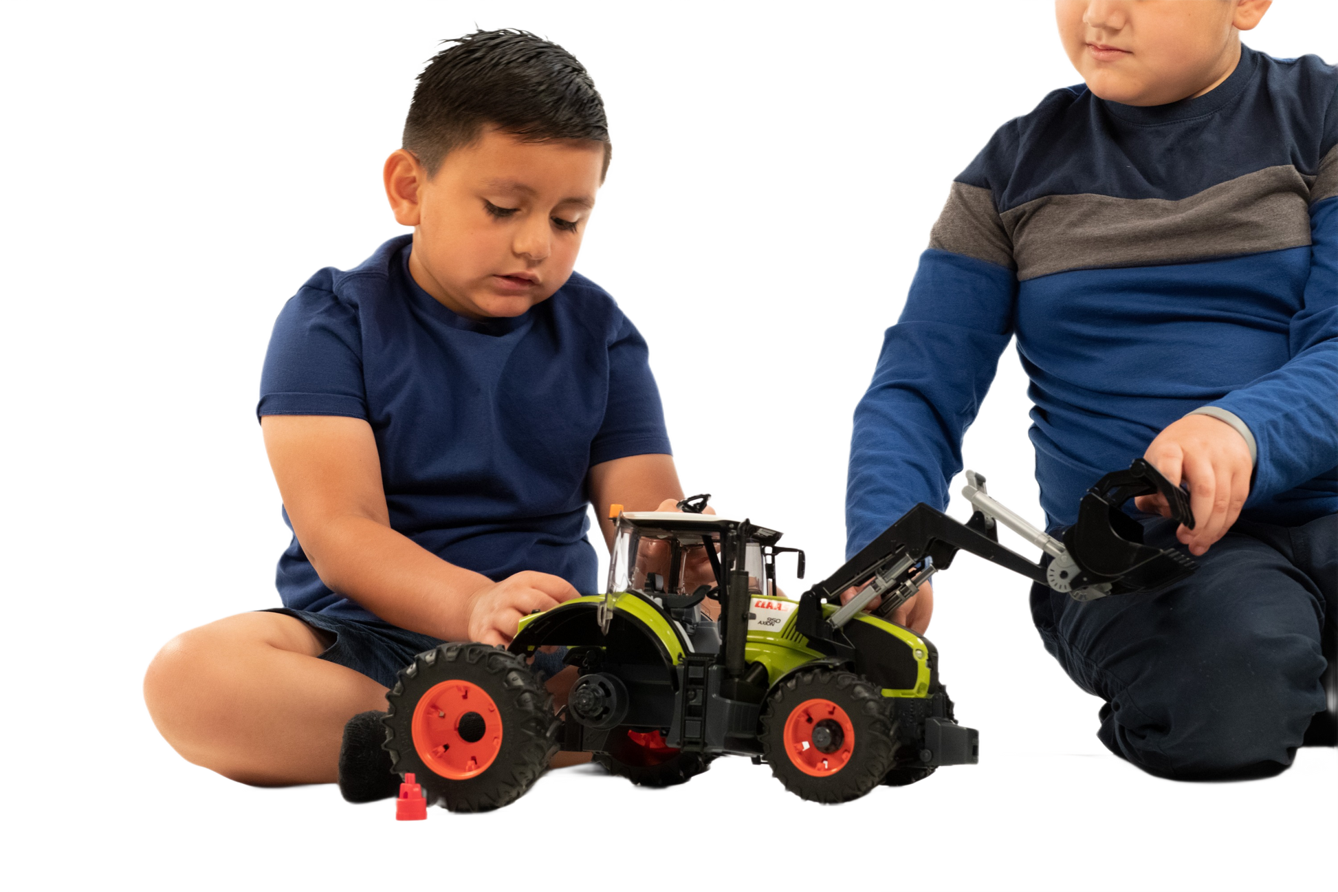 Two children playing with a Bruder Claas Xerion 5000 Tractor model in Vehicles & Remote Controlled Toys collection