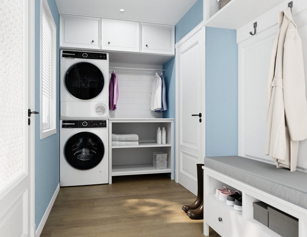 Laundry room with stacked white front-load washer and dryer, shelving with towels and cleaning supplies, and blue walls