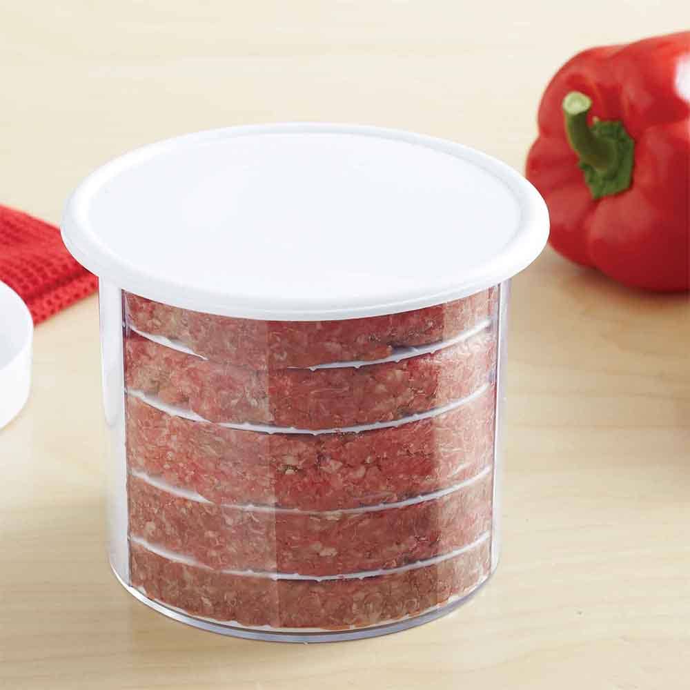 Multi-layer burger press and storage container filled with stacked raw burger patties on wooden surface