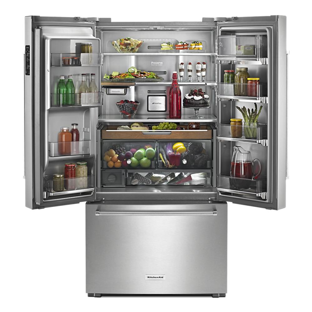 Open stainless steel French door refrigerator with Platinum interior and flexible storage shelves in kitchen setting