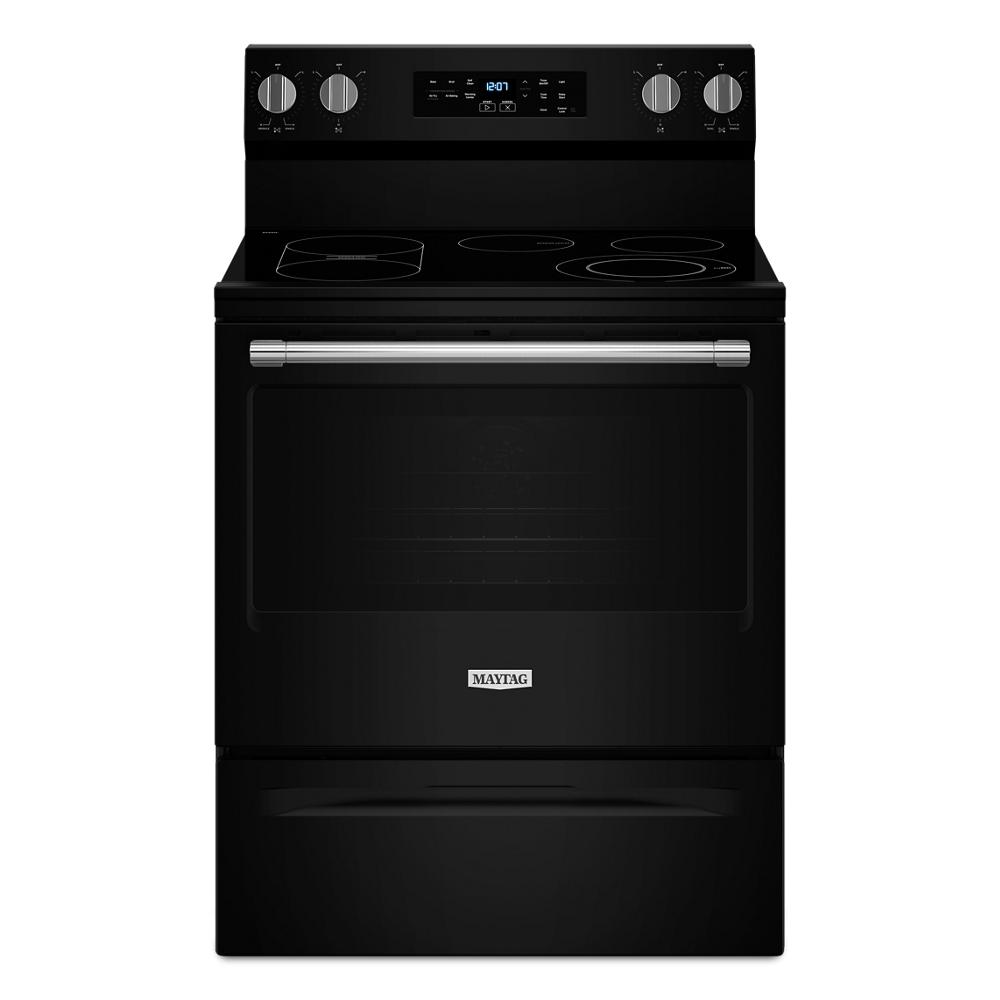 Black electric range with smooth cooktop, digital control panel, and stainless steel handle in ranges and kitchenware collections