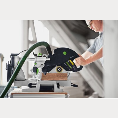 Skilled user cutting wood precisely with Festool sliding compound miter saw in Power Tools and Home Improvement collections