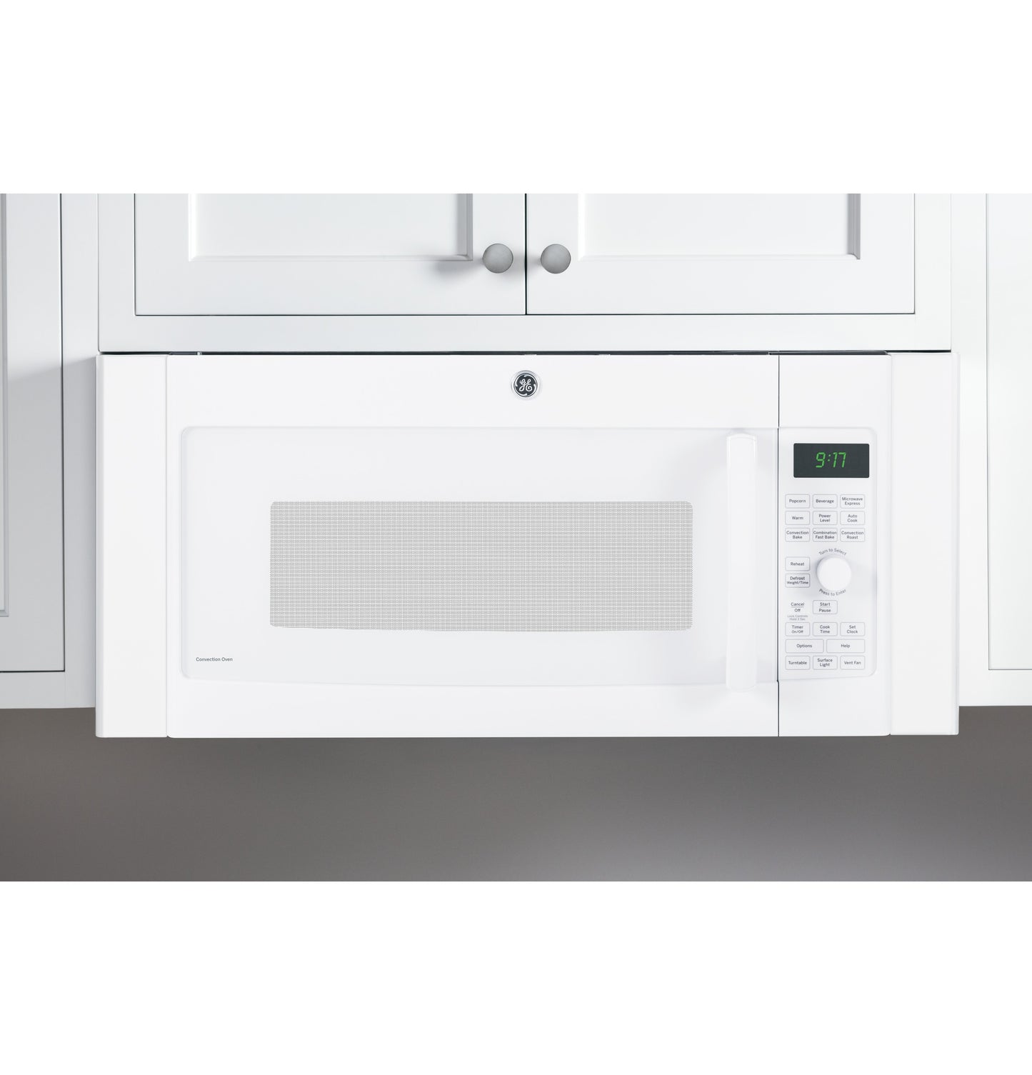 White over-the-range microwave installed under white cabinetry, part of kitchen and appliance collections