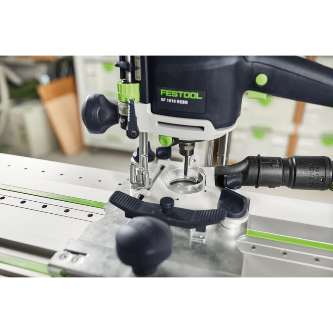 Festool woodworking router attached to a guide rail for precise drilling and cutting in wood tool accessories.