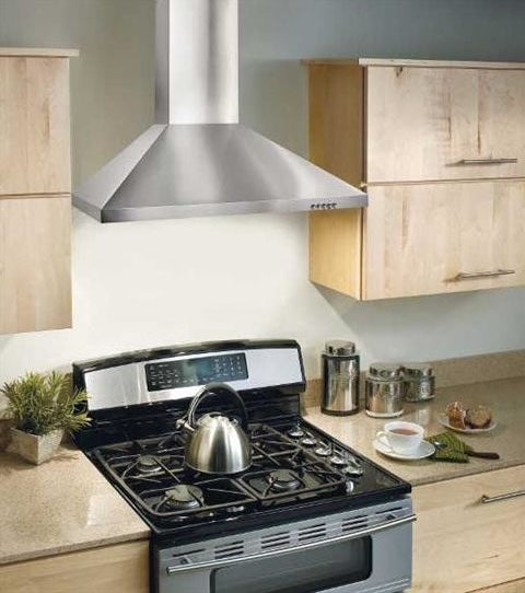 Modern stainless steel chimney hood installed above a gas stove with teak cabinetry and countertop accessories, part of Range Hoods and Kitchen & Kitchenware collections for home improvement.