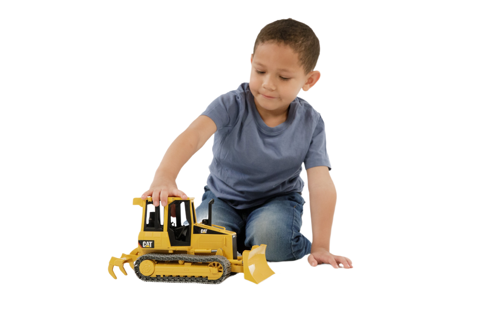 Child playing with a yellow Bruder Caterpillar track-type tractor toy from Vehicles & Remote Controlled Toys collection