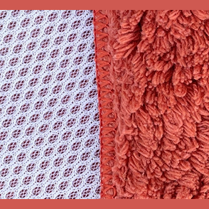 Close-up of two textured kitchen scrubbers in stoneware clay color from Janey Lynn's Designs under $50 collection