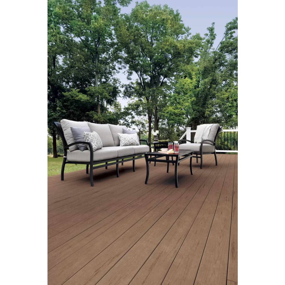 Outdoor seating set with cushioned sofa and chairs on smooth brown oak composite decking for home improvement