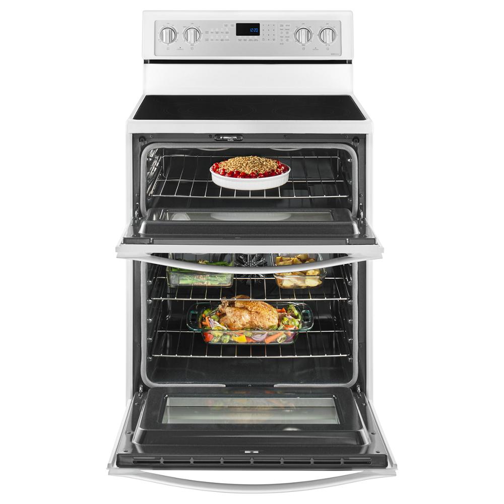 Electric double oven range with true convection cooking, showing baked dishes inside both oven compartments