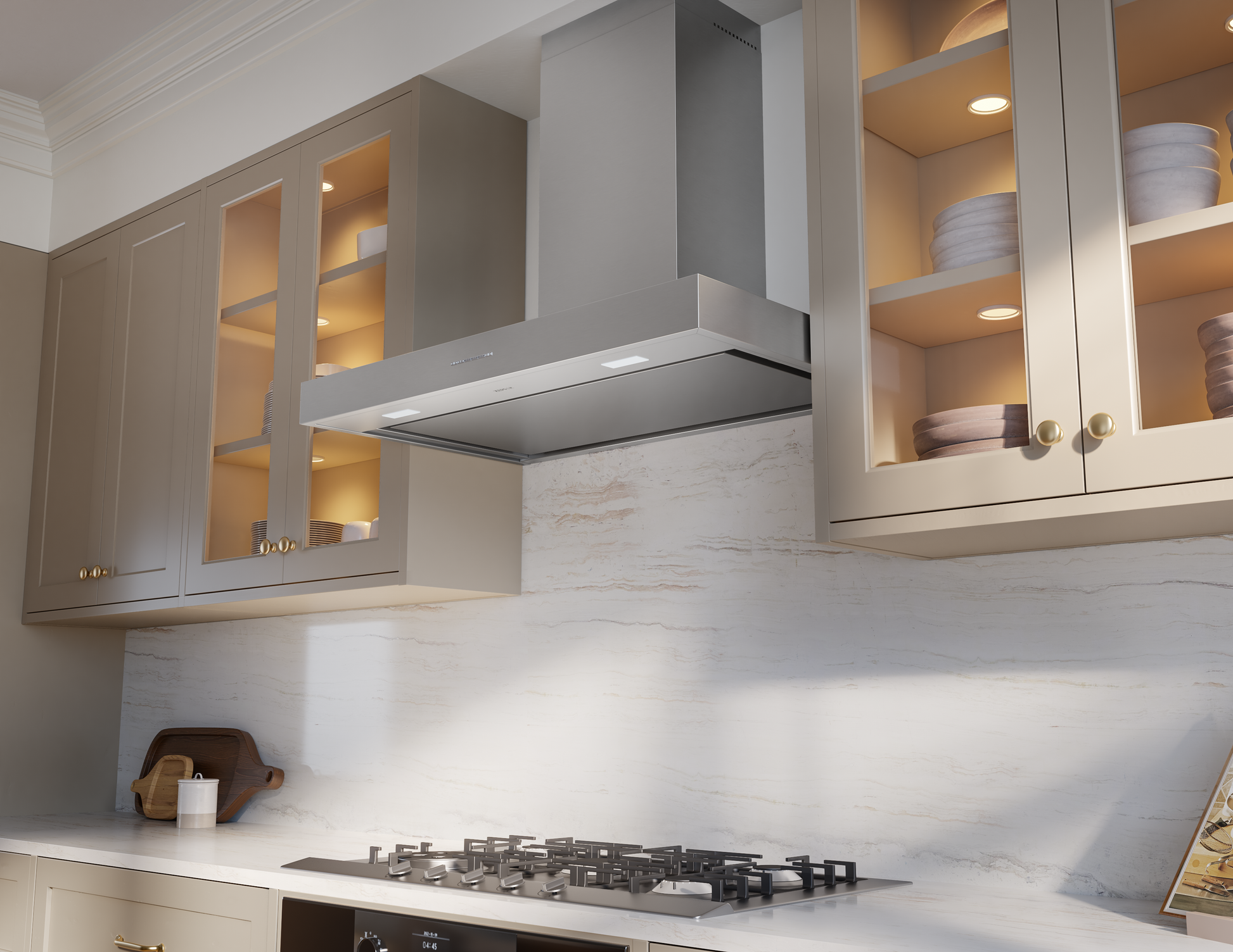 Sleek stainless steel wall mounted range hood with pyramid design above gas cooktop in modern kitchen setting