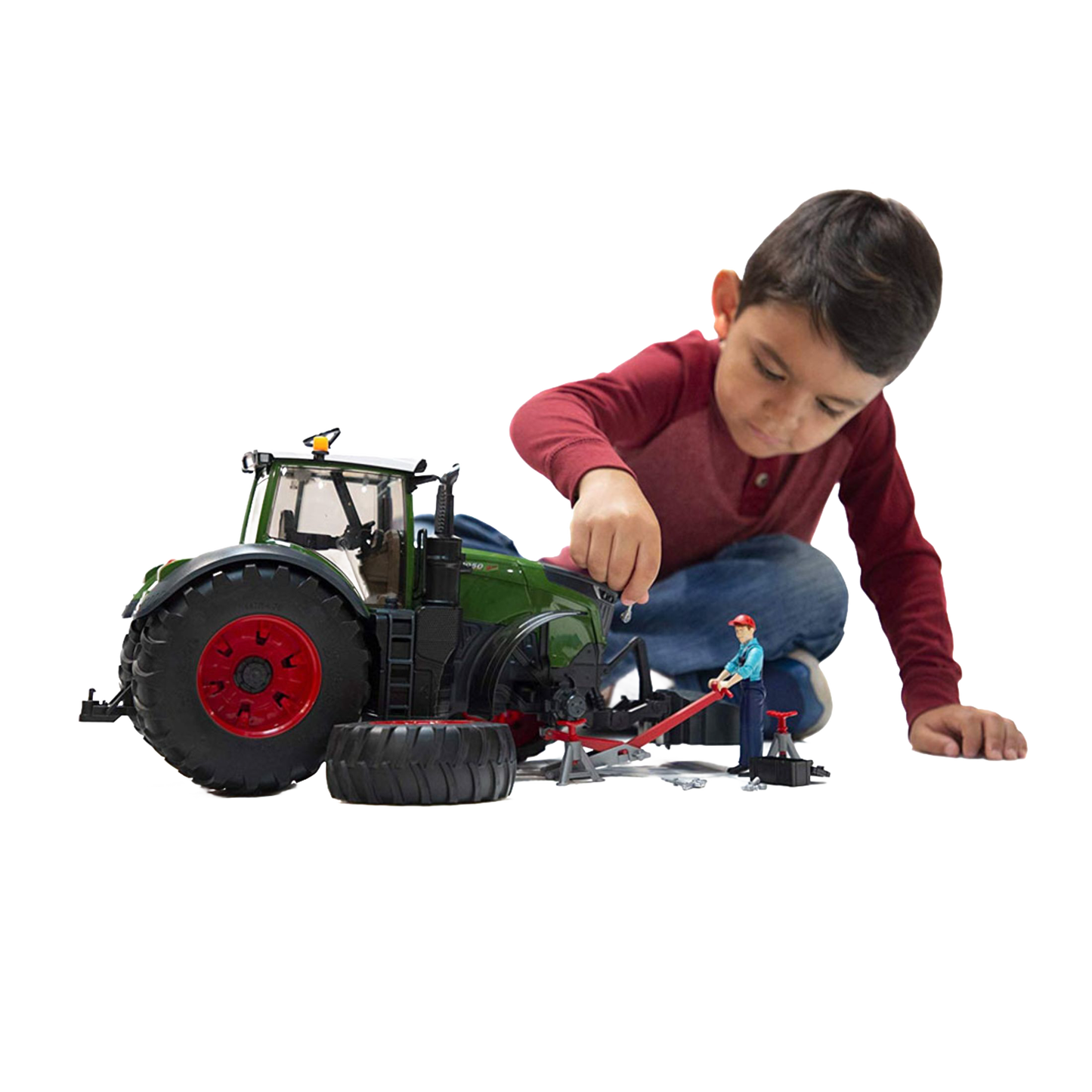 Child playing with Bruder green tractor toy and repair accessories from Vehicles & Remote Controlled Toys collection under $100