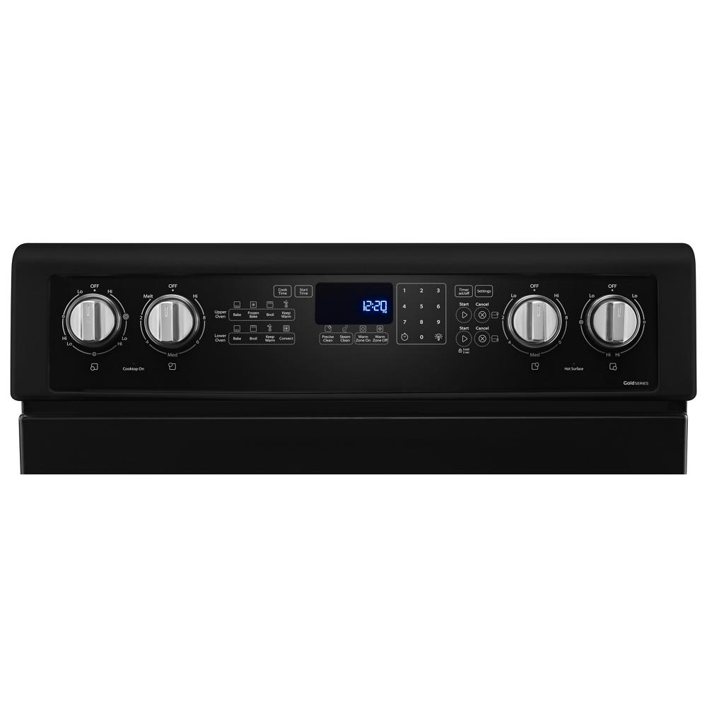 Control panel of black electric double oven range with digital display and silver knobs from ranges collection
