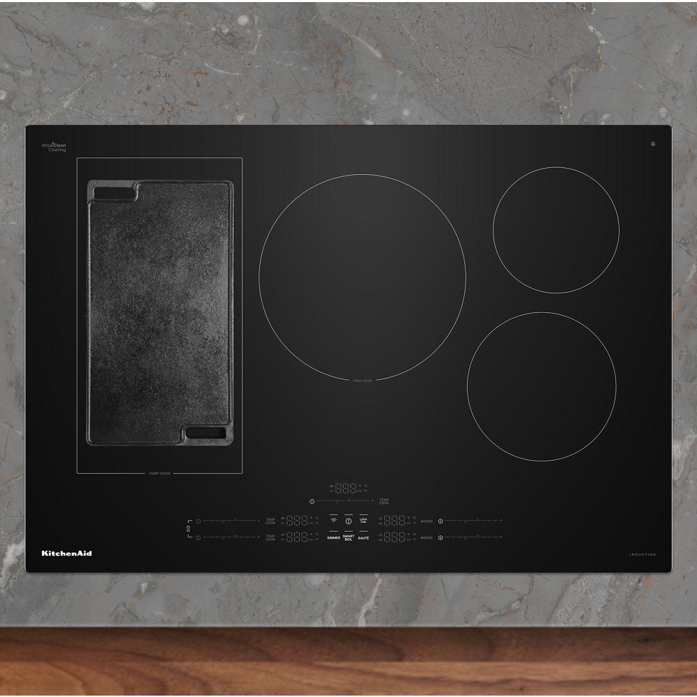 Black induction cooktop with five cooking zones and integrated griddle from KitchenAid induction cooktops collection