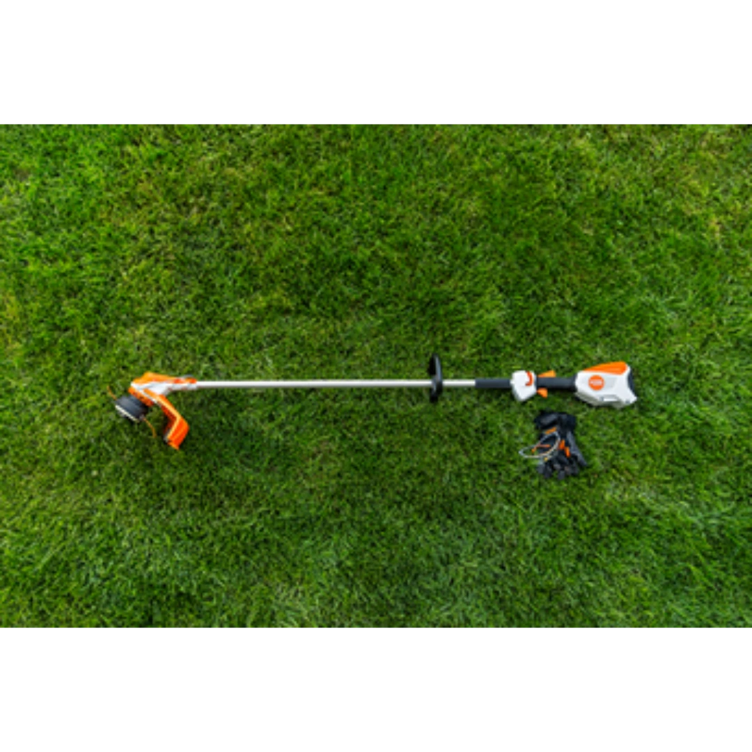 Compact battery-powered trimmer with ergonomic handle and protective guard for efficient outdoor lawn maintenance tasks