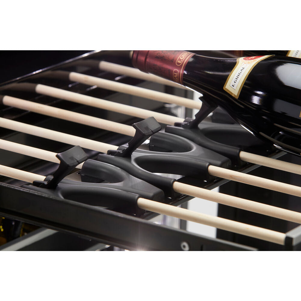 Close-up of wooden slat wine rack with black plastic clips holding bottles in under-counter wine cellar from kitchen appliances collection