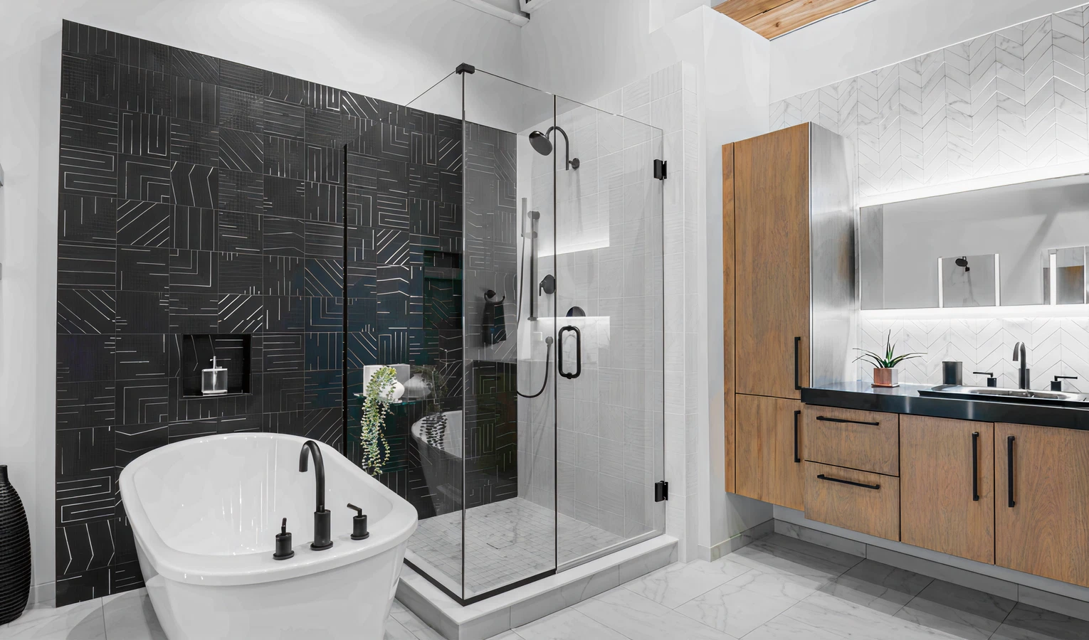 Modern bathroom featuring a freestanding tub with matte black fixtures, a glass-enclosed shower with dark geometric tiles, wood cabinetry, and a backlit mirror.