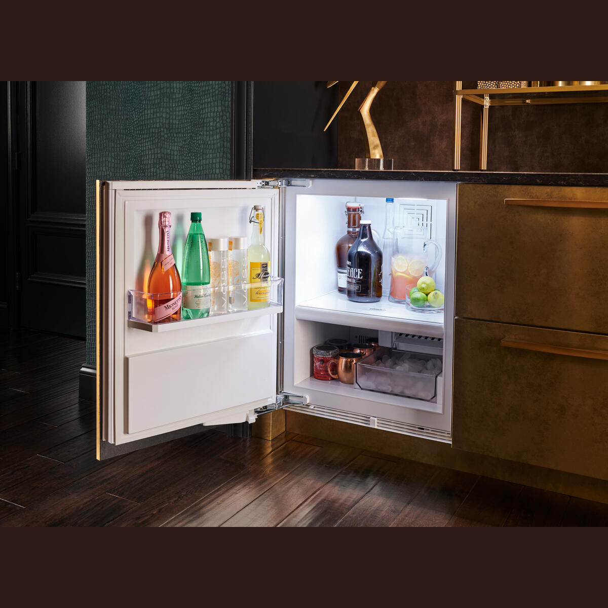 Under counter refrigerator/freezer with customizable panels, stocked with drinks, ideal for kitchen and home improvement.