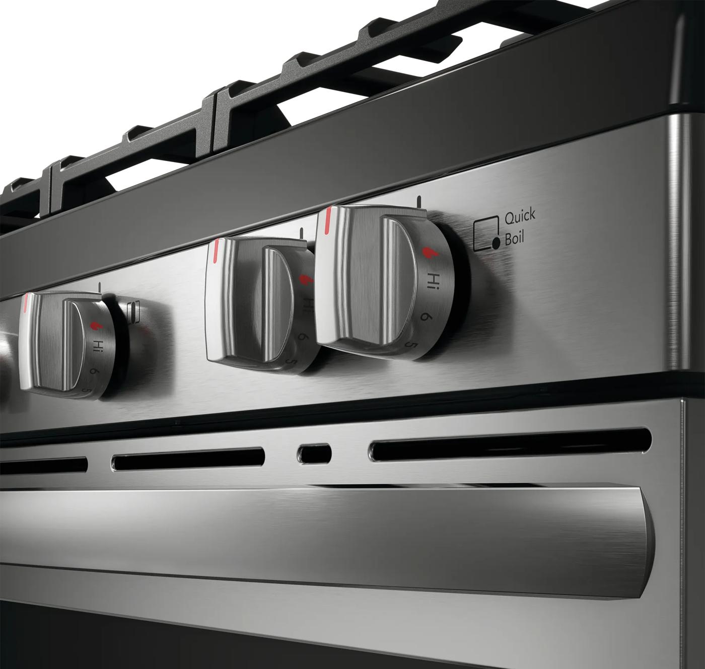 Close-up of brushed stainless steel gas range control knobs with Quick Boil setting in kitchen and home improvement appliances collection