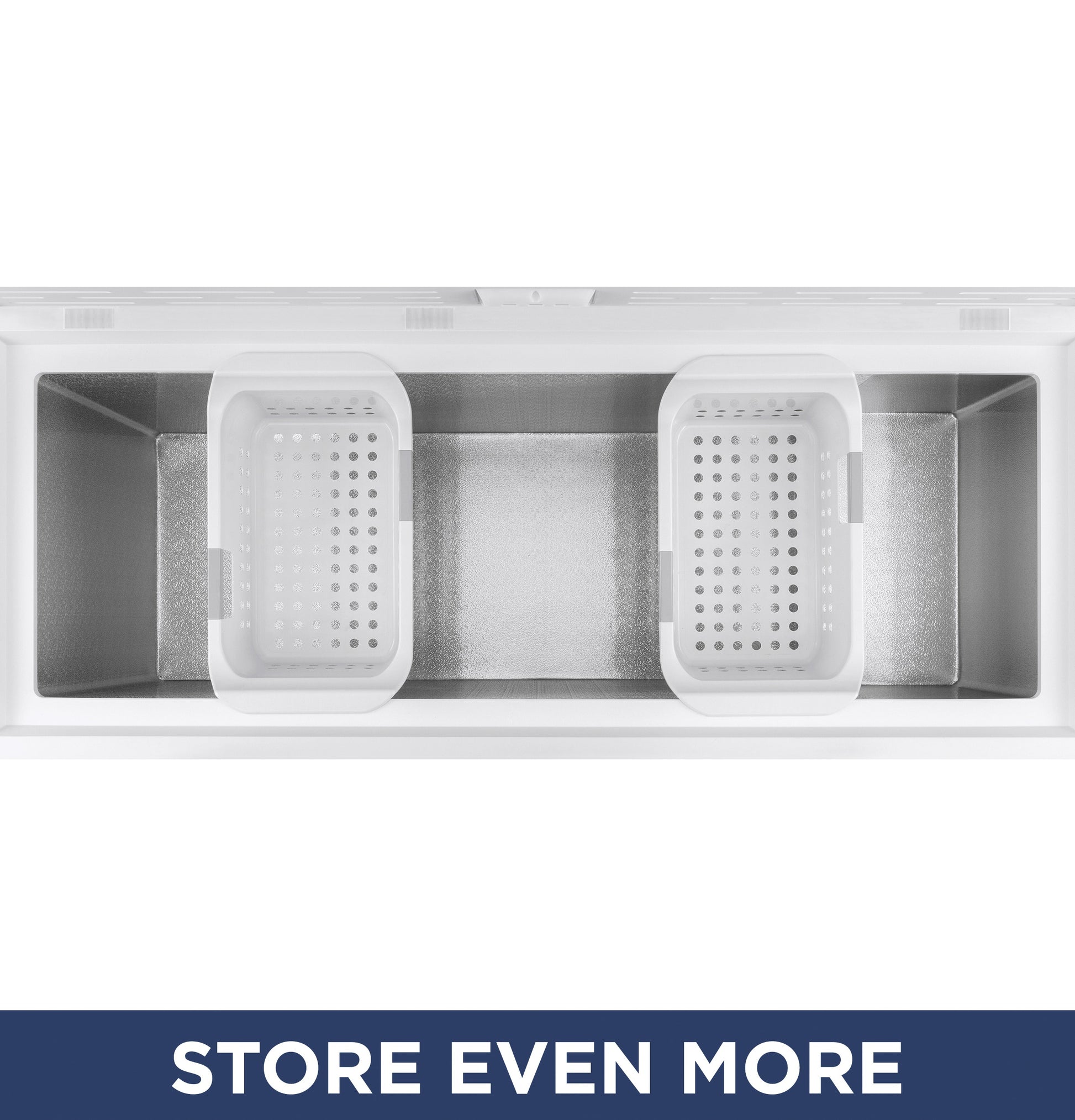Top-down view of empty chest freezer interior with two removable white storage baskets for kitchen and home appliances.